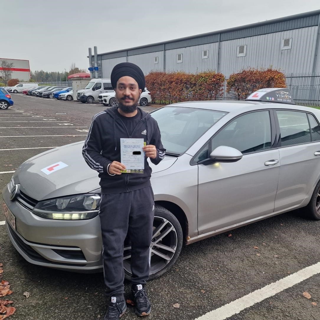 Student celebrating after passing his driving test with Vision School of Motoring